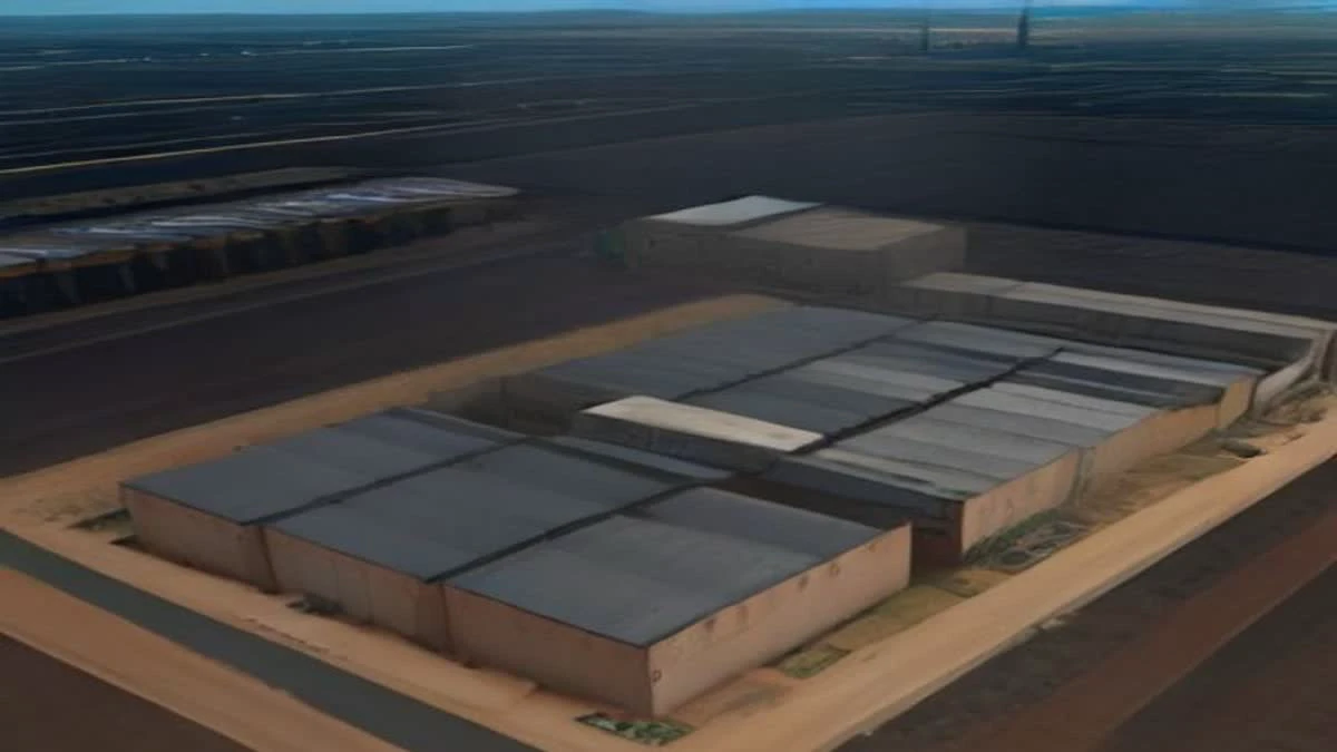 Containerised mining buildings on an industrial site photographed from above under overcast daylight